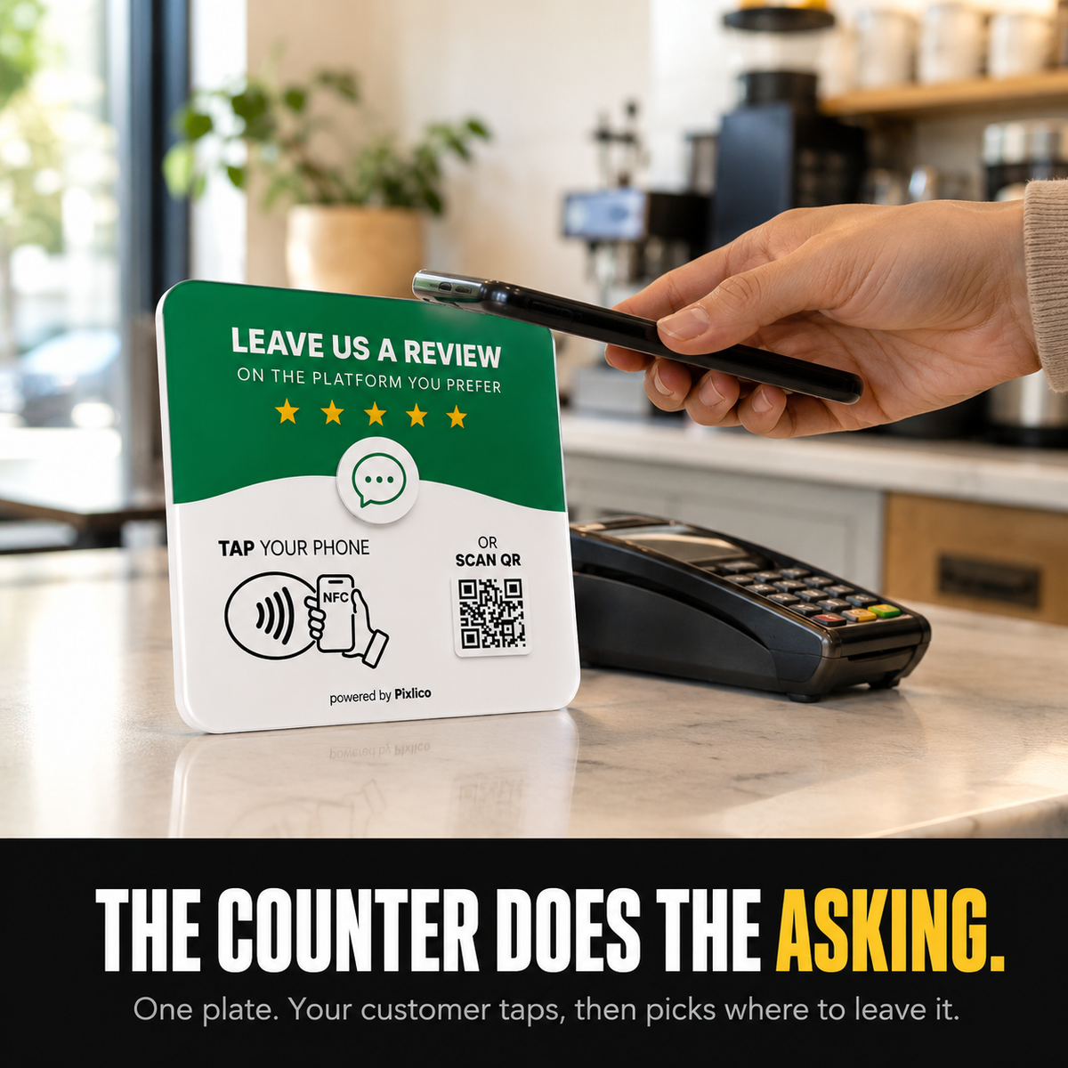 Customer tapping phone on the Pixlico plate at a cafe counter