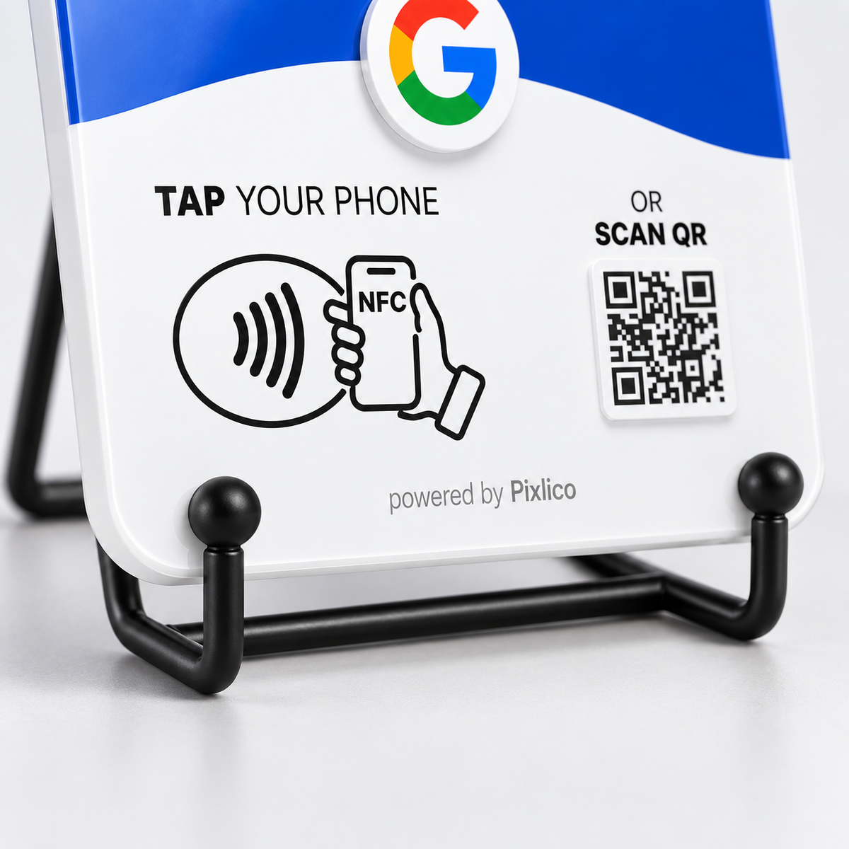 Close-up of the two ball tips holding the bottom edge of a Pixlico NFC plate